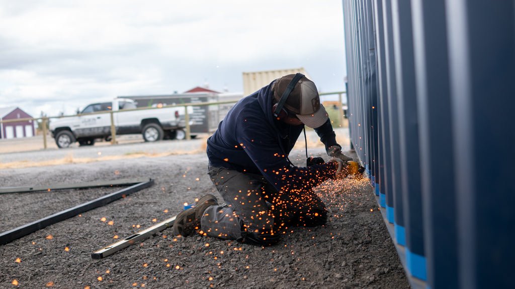 Cascade Crate's Team Member Modifying A Shipping Container
